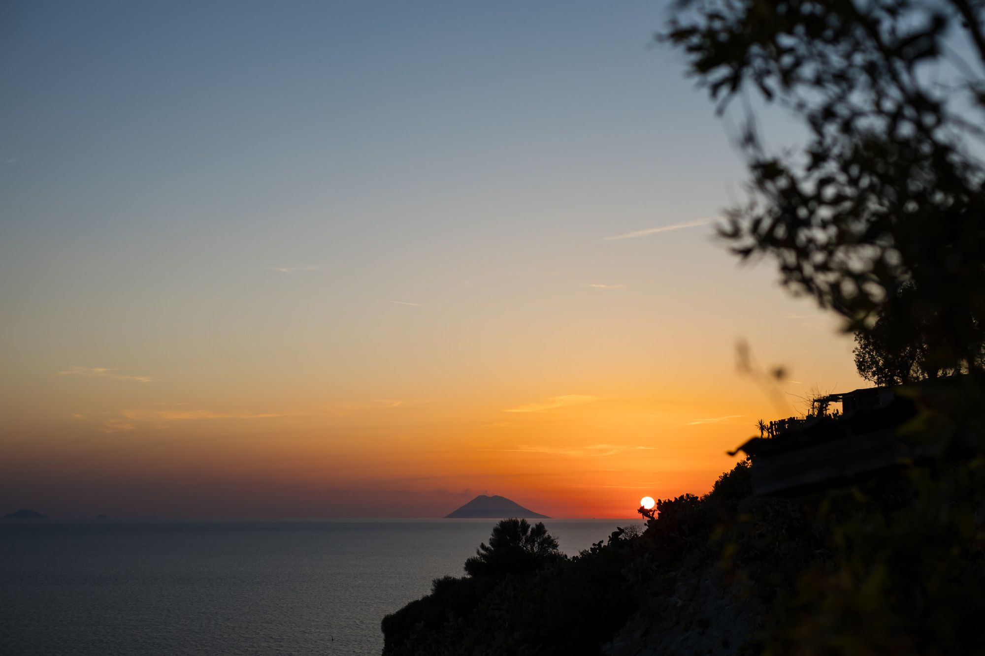Sunset over the sea and the Aeolian Islands from the Calabrian coast